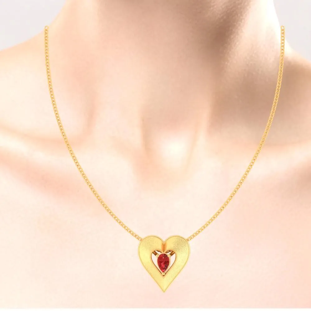 22k Heart Shaped Gold Pendant With A Red Stone In The Middle