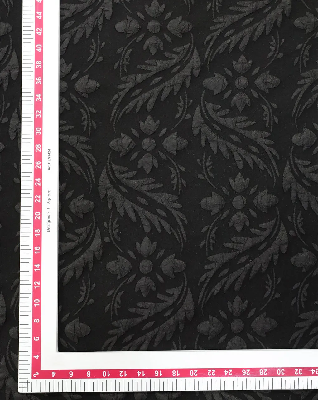 BLACK POLYESTER EMBOSSED JACQUARD FABRIC