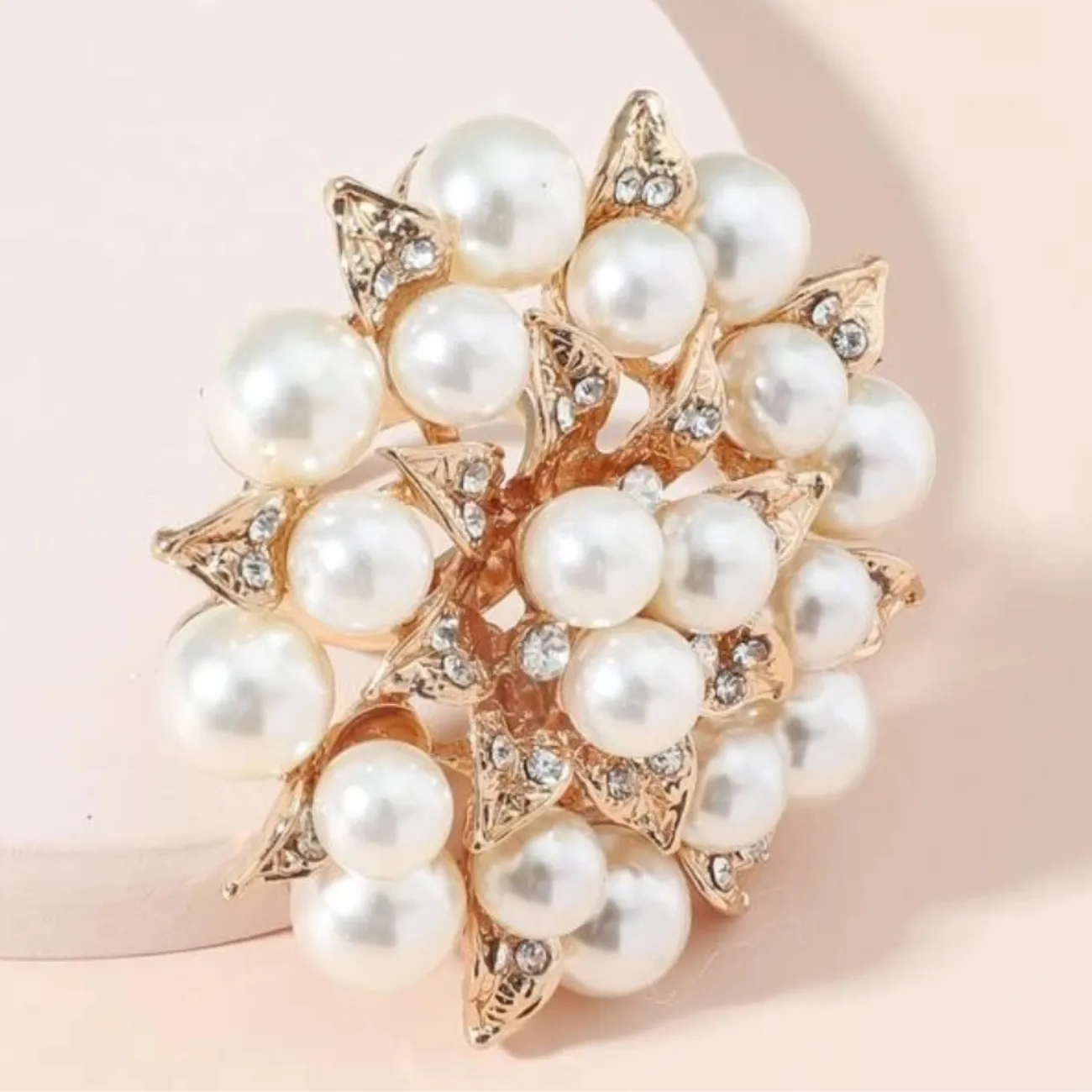 Faux pearl and rhinestone flower ring.